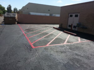 red fire lane striping in Phoenix parking lot.